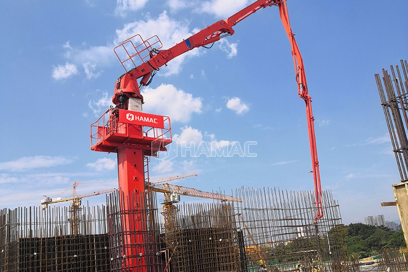 Self-climbing concrete placing boom